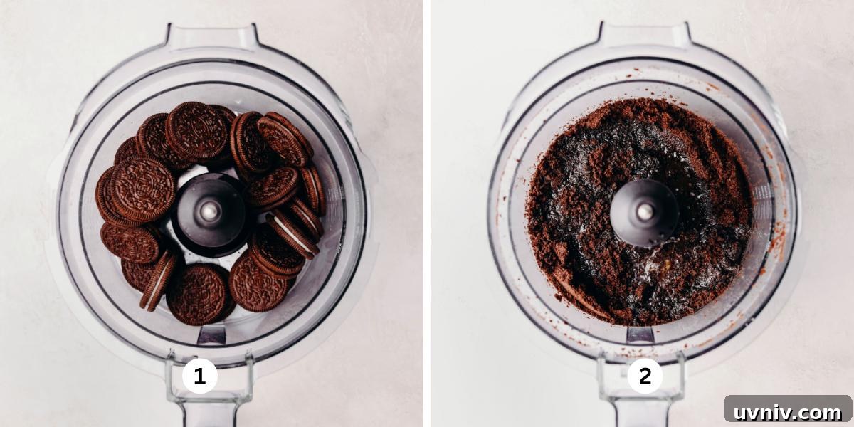 Chocolate sandwich cookies in a food processor, then processed with melted butter on a white background.