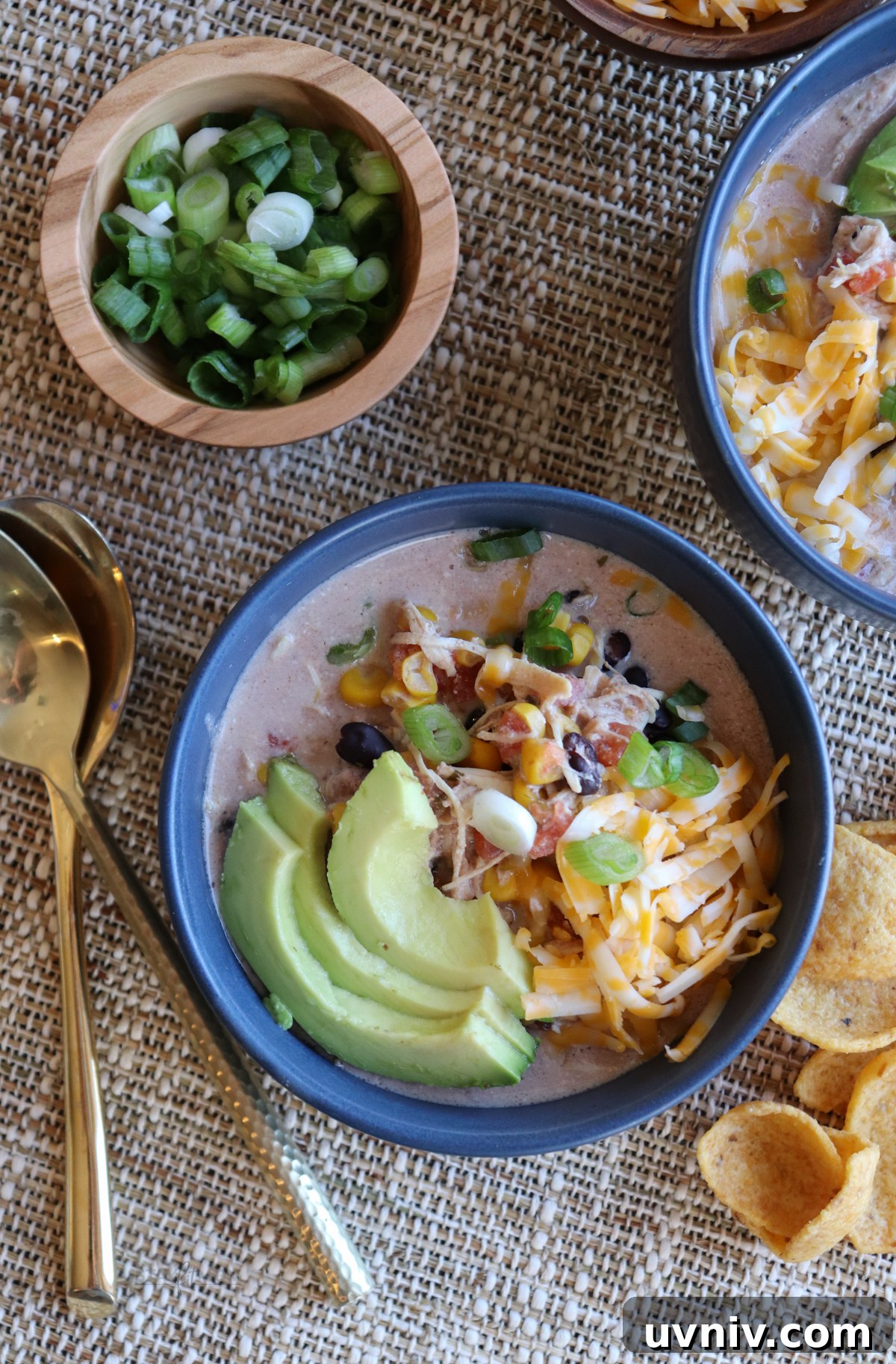 Cream Cheese Chicken Chili Recipe: Creamy Slow Cooker Chili 4 Stay Fit Mom Cream Cheese Chicken Chili topped with avocado, cheese, and green onions. #chickenchili