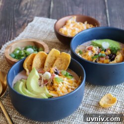 Cream Cheese Chicken Chili Recipe: Creamy Slow Cooker Chili 5 White chicken chili with Fritos, avocado, beans, corn, and green onions. #stayfitmom #chickenchili