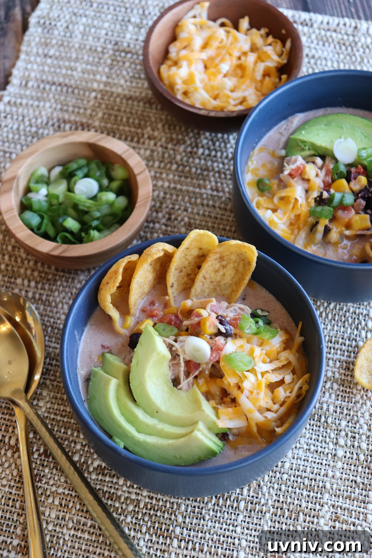 Cream Cheese Chicken Chili Recipe: Creamy Slow Cooker Chili 6 Stay Fit Mom Cream Cheese Chicken Chili topped with avocado, cheese, and green onions. #chickenchili