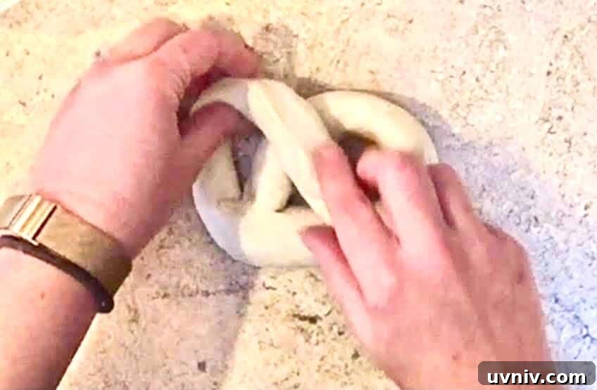 Spinach Artichoke-Stuffed Beer Soft Pretzels 10 Forming Pretzel Shape