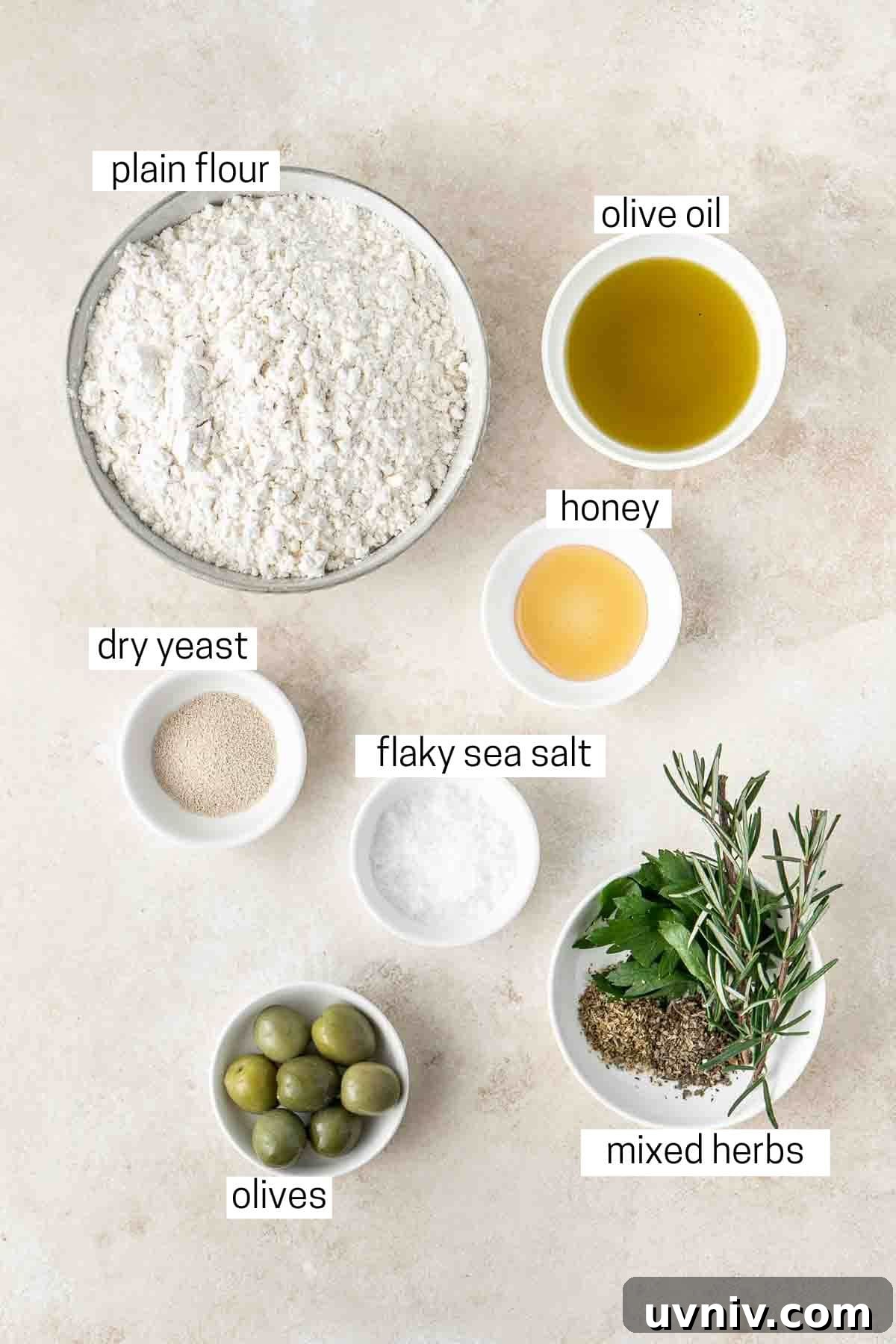 Olive & Herb Focaccia Recipe — Crispy, Flavorful Italian Bread 3 All ingredients needed to make olive and herb focaccia laid out in small bowls.