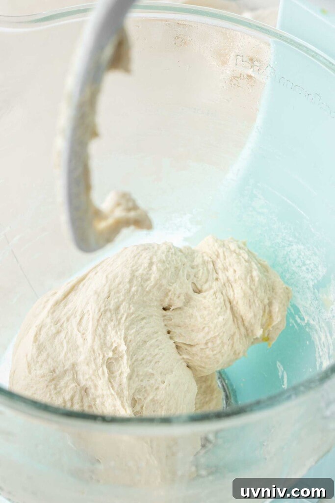 Olive & Herb Focaccia Recipe — Crispy, Flavorful Italian Bread 5 Mixing the dough with a stand mixer.
