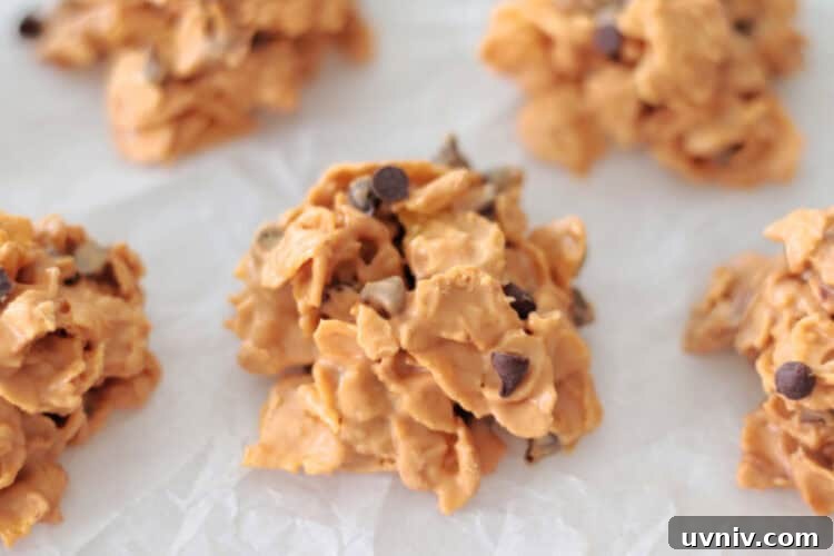 No-Bake Butterscotch Cornflake Cookies Recipe 4 corn flake cookies on parchment paper