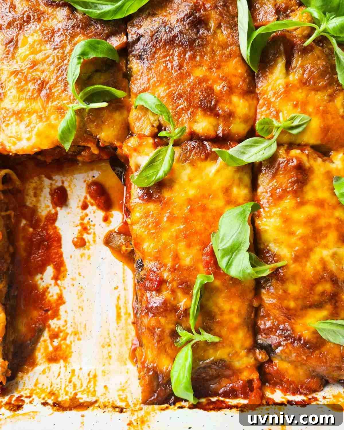 Overhead view of a tray of eggplant parmigiana