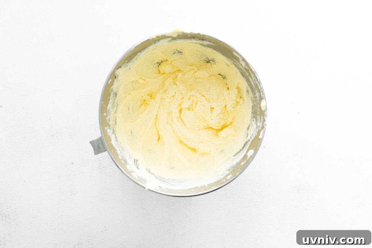 Strawberry Rhubarb Layer Cake Recipe for Summer Baking 7 thick cake batter in a stainless mixing bowl.