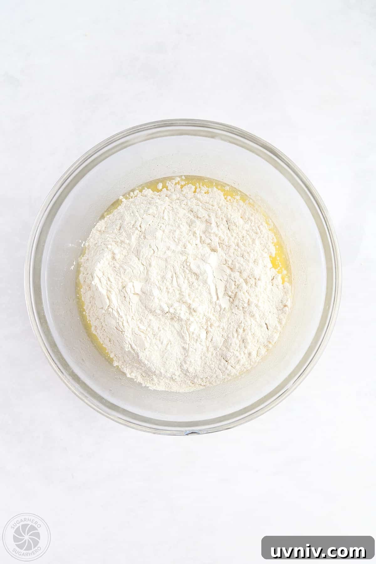 Zesty Lemon Bars: Classic Tangy Dessert Bar Recipe 12 Ingredients for shortbread crust in a clear mixing bowl.