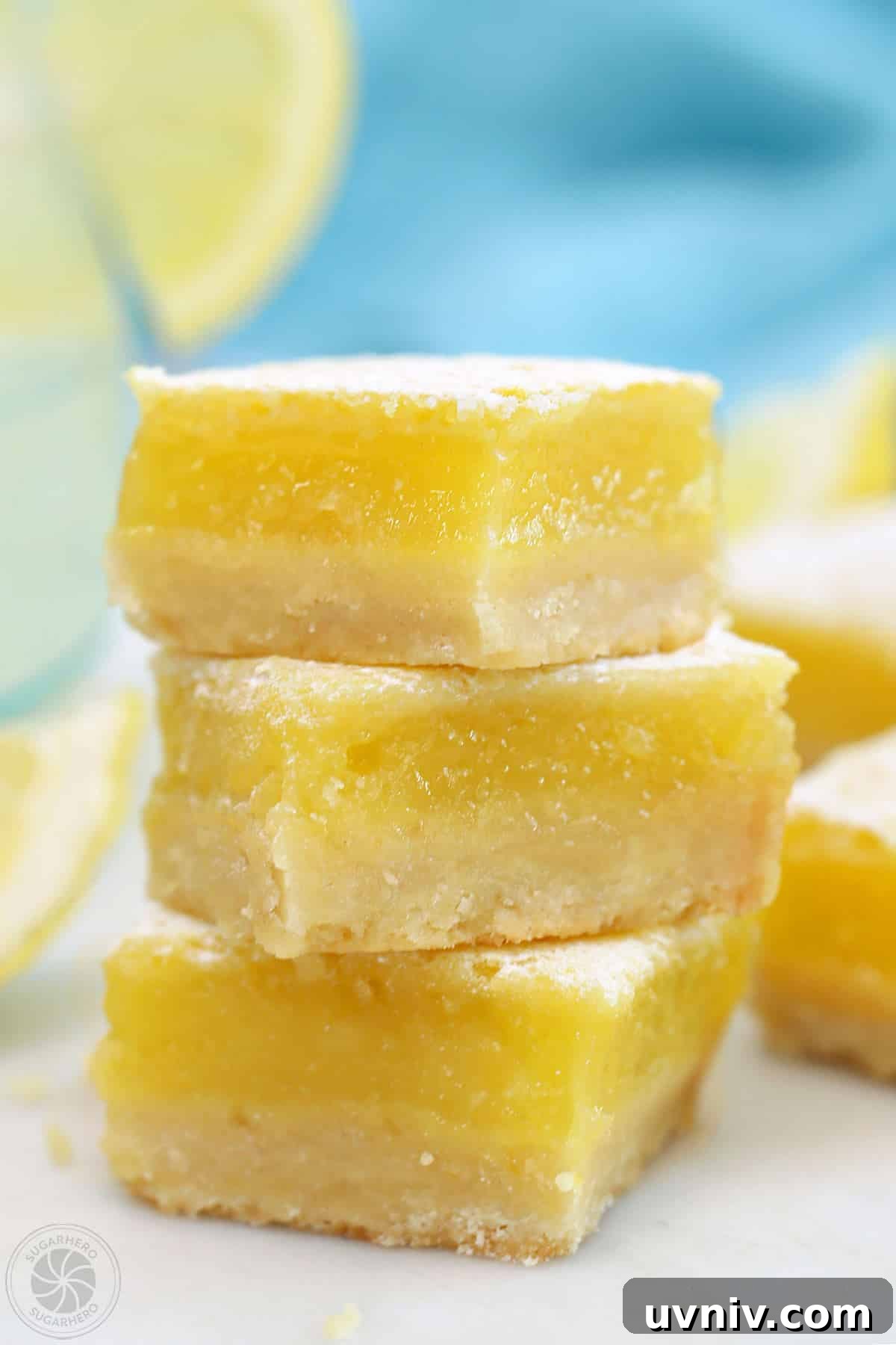 Zesty Lemon Bars: Classic Tangy Dessert Bar Recipe 17 A stack of three lemon bars.