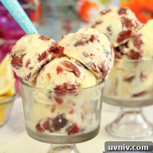Zesty Lemon Bars: Classic Tangy Dessert Bar Recipe 20 Several scoops of Lemon Sour Cherry Ice Cream in a clear cup with a teal spoon.