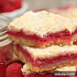 Zesty Lemon Bars: Classic Tangy Dessert Bar Recipe 7 2 Raspberry Rhubarb Almond Bars next to a container of jam.