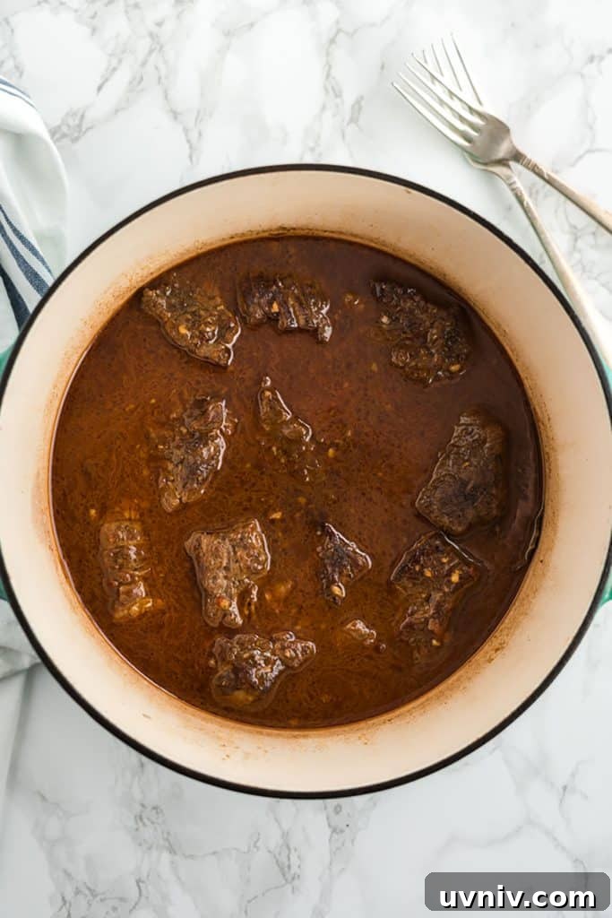 Chipotle Beef Barbacoa Recipe: Smoky Slow-Cooked Mexican Beef 9 juicy chipotle beef in a pot