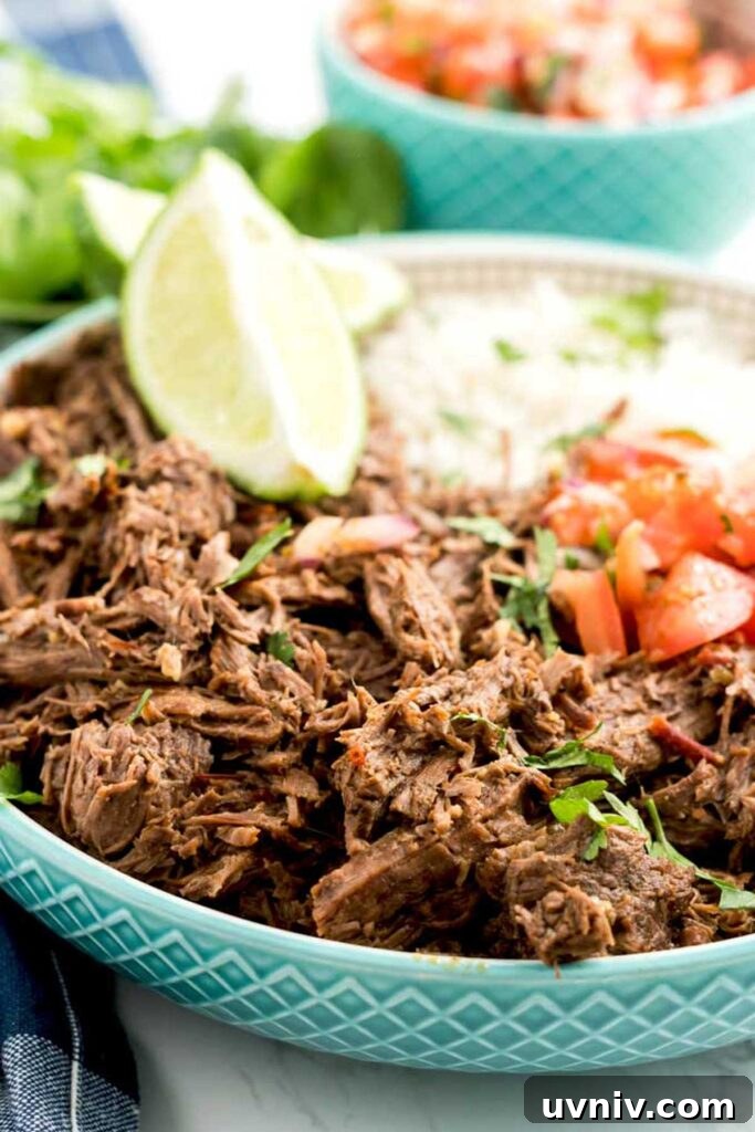 Chipotle Beef Barbacoa Recipe: Smoky Slow-Cooked Mexican Beef 11 Barbacoa beef bowl with rice and pico de gallo