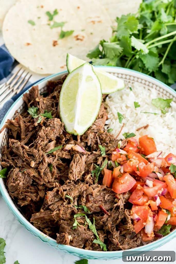 Chipotle Beef Barbacoa Recipe: Smoky Slow-Cooked Mexican Beef 13 Barbacoa beef bowl with rice and pico de gallo