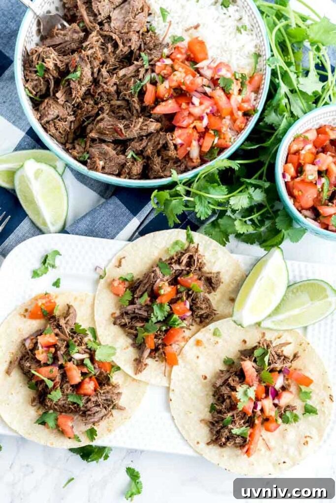 Chipotle Beef Barbacoa Recipe: Smoky Slow-Cooked Mexican Beef 3 Chipotle beef barbacoa layered on tortillas topped with pico de gallo