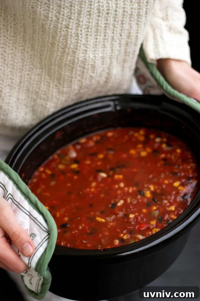 Holding a Pot of Vegan Chili