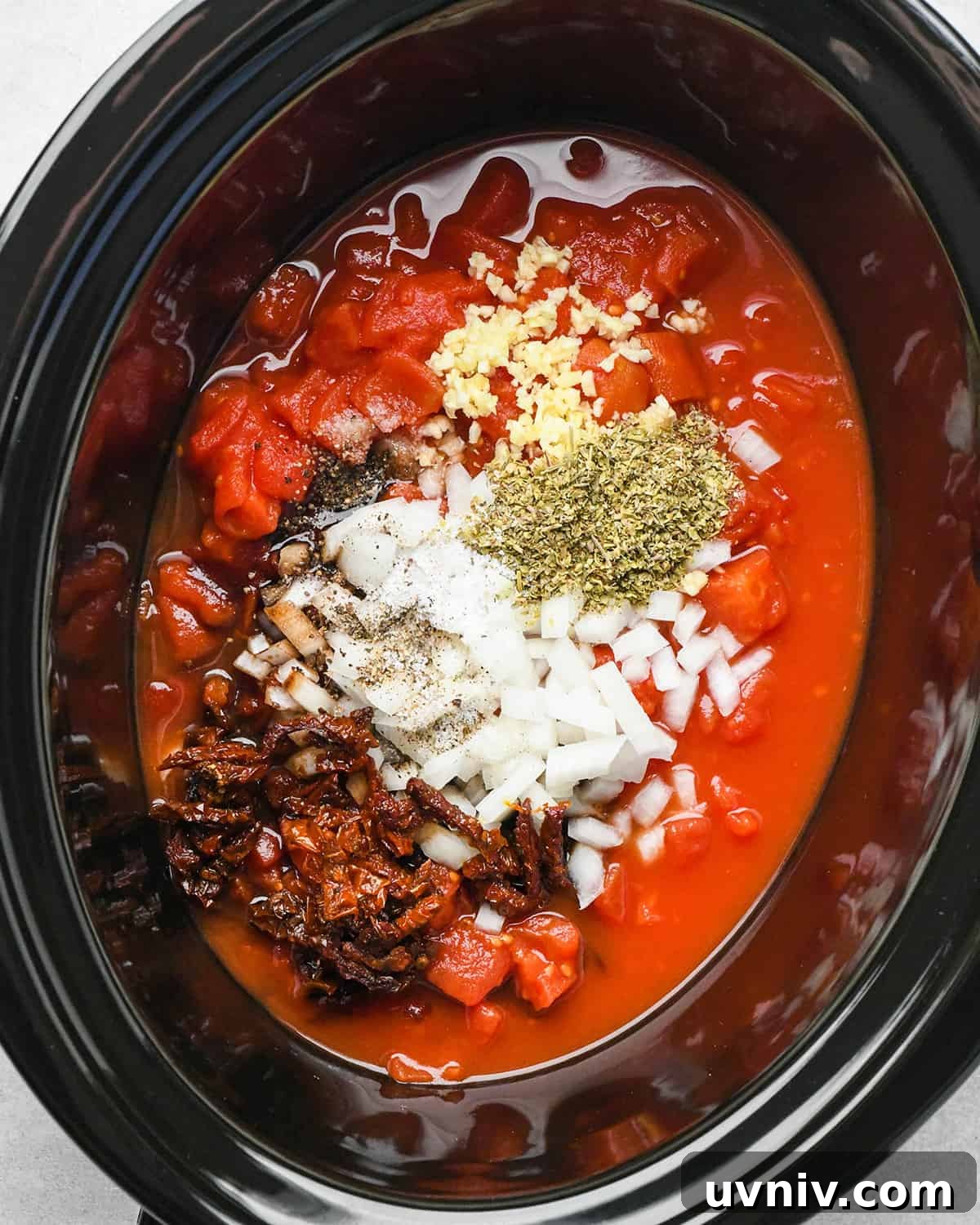 Slow Cooker Italian Chicken Recipe for Tender, Flavorful Meals 6 Slow Cooker Italian Chicken sauce ingredients in a crockpot before mixing