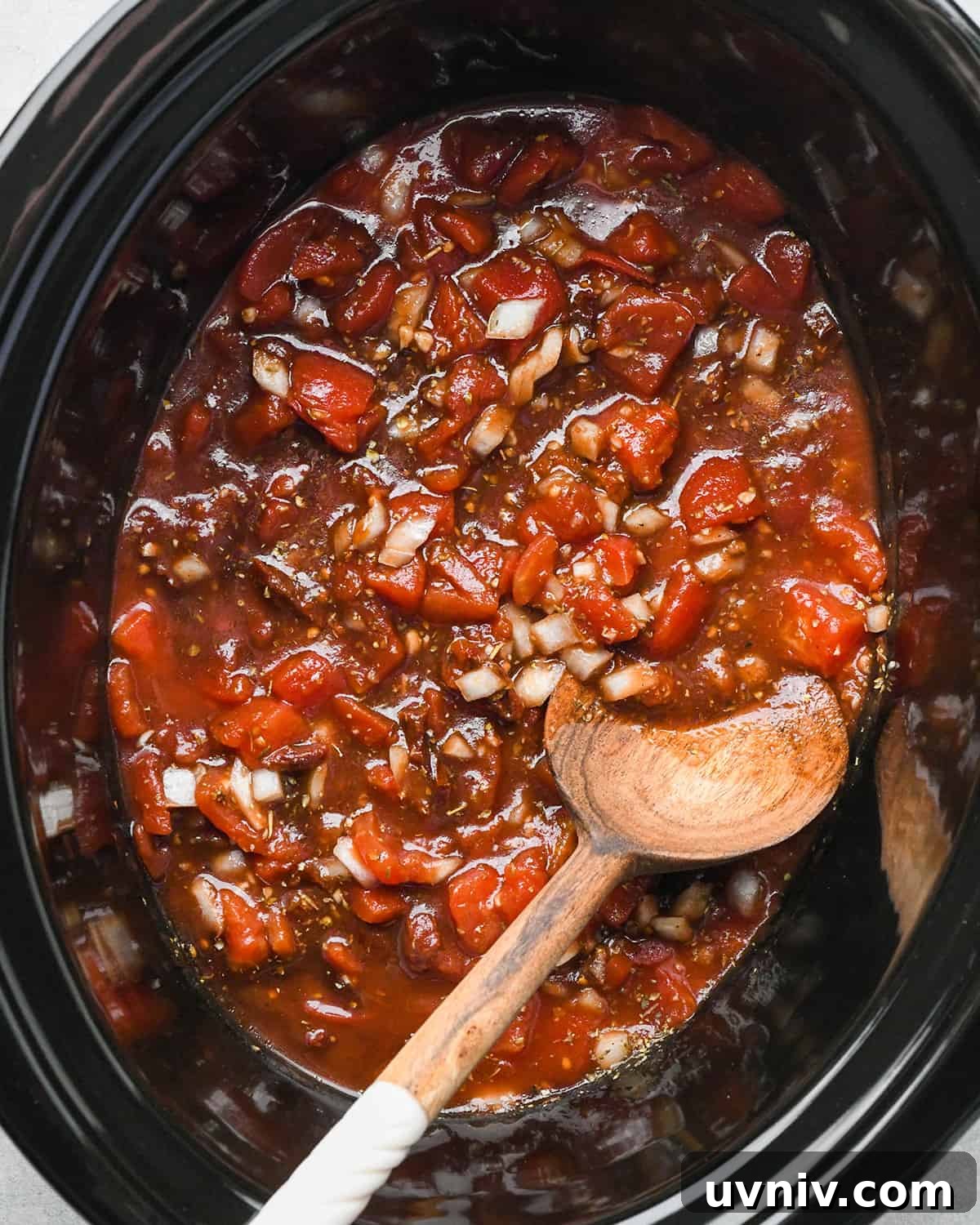 Slow Cooker Italian Chicken Recipe for Tender, Flavorful Meals 7 Slow Cooker Italian Chicken sauce ingredients in a crockpot after mixing