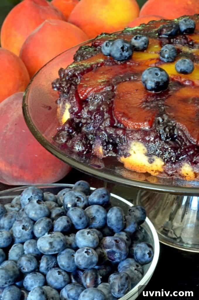 A close up of a cake and a bowl of blueberries