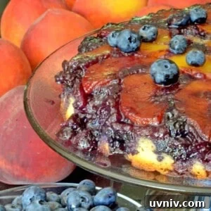 A peach cake with blueberries on top.