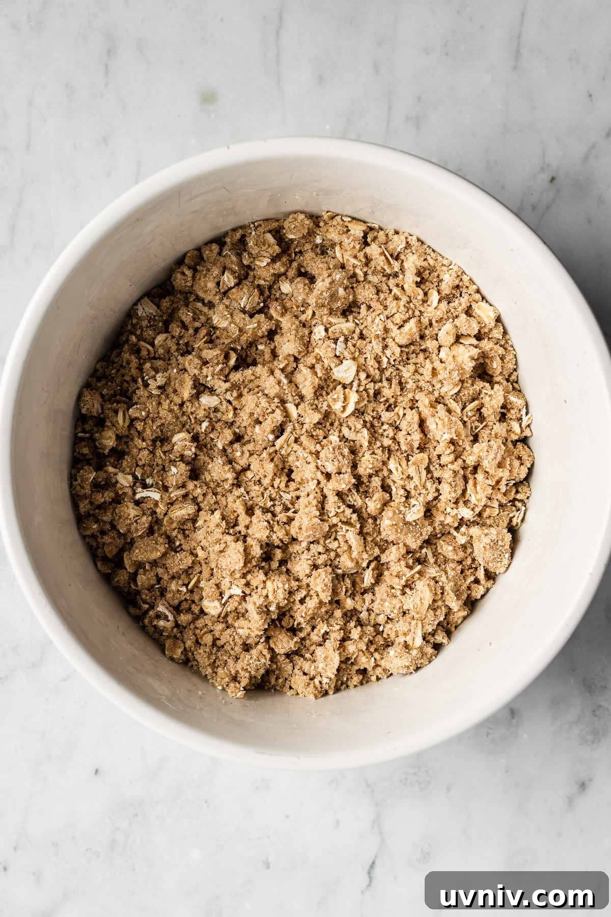 A bowl of topping for a fruit crisp.