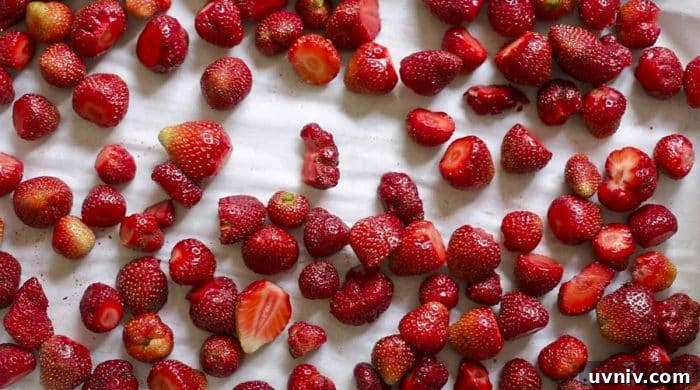 Freeze Strawberries Properly: Step-by-Step Guide for Fresh Flavor 8 strawberries spread out on a parchment lined baking sheet