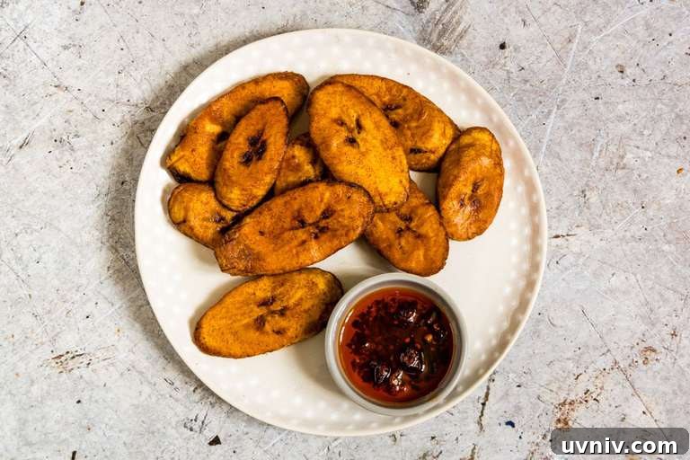 Crispy Fried Plantains Recipe: Sweet and Savory Guide 5 fried plantains on a plate with chutney