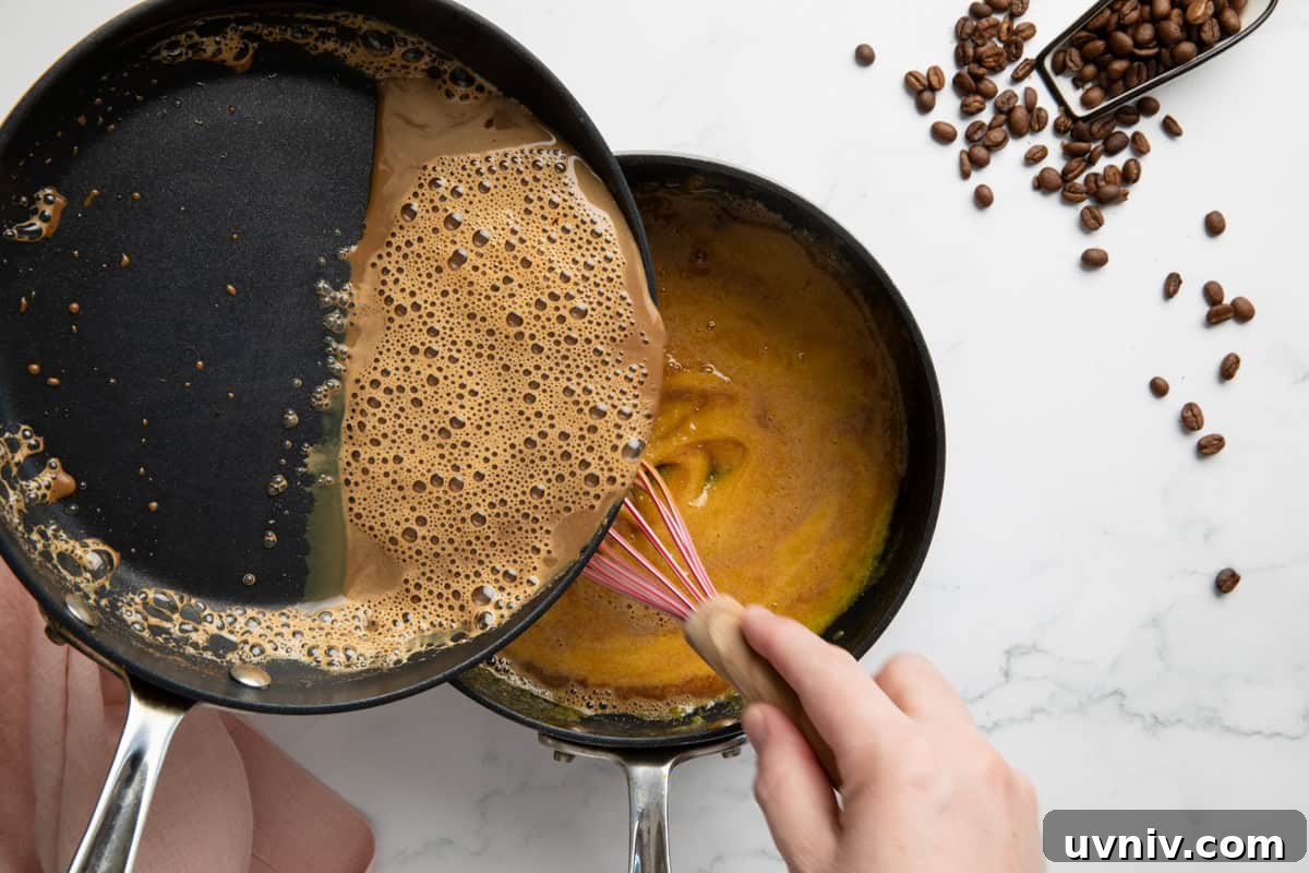 Homemade Espresso Ice Cream Recipe — Rich Coffee Gelato 4 Egg yolks being tempered with warm espresso milk.