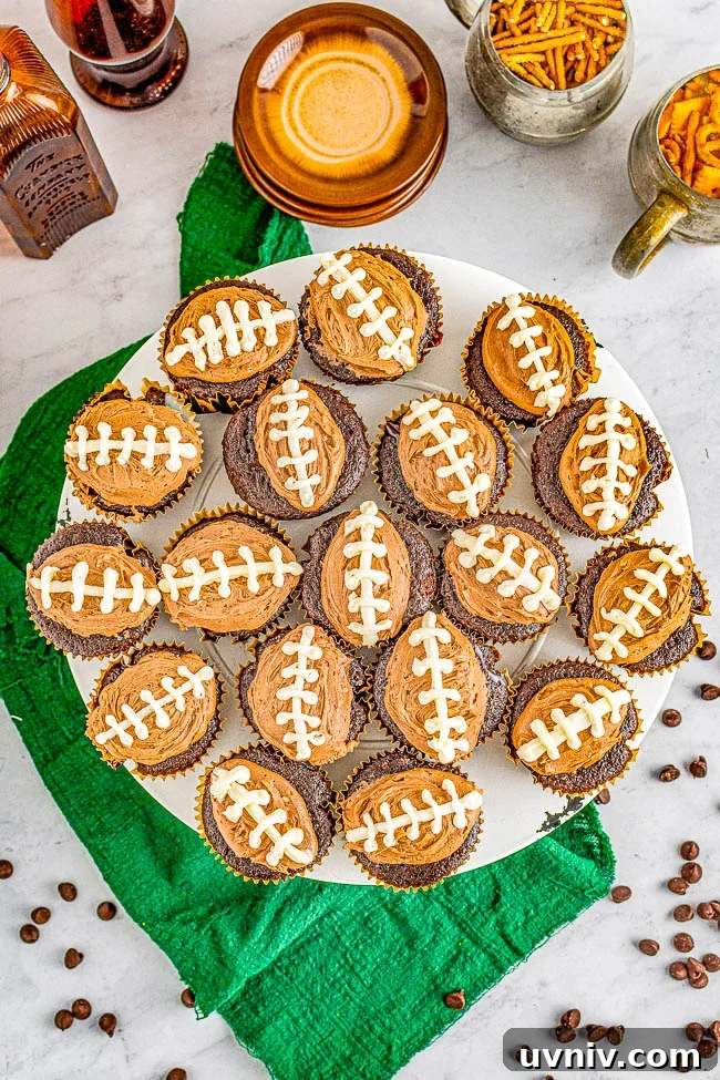 Chocolate Football Cupcakes: Game-Day Dessert Recipe 2 Chocolate Football Cupcakes - Decadent chocolate cupcakes, filled with smooth rich chocolate ganache, and topped with creamy chocolate buttercream frosting for a trifecta of chocolate! The cupcakes will be game day winners with all your hungry fans!