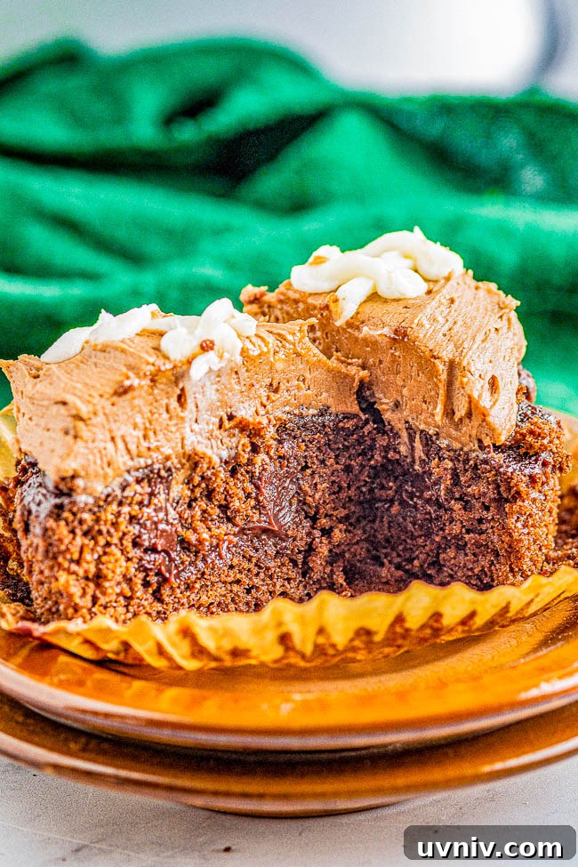 Chocolate Football Cupcakes: Game-Day Dessert Recipe 3 Chocolate Football Cupcakes - Decadent chocolate cupcakes, filled with smooth rich chocolate ganache, and topped with creamy chocolate buttercream frosting for a trifecta of chocolate! The cupcakes will be game day winners with all your hungry fans!