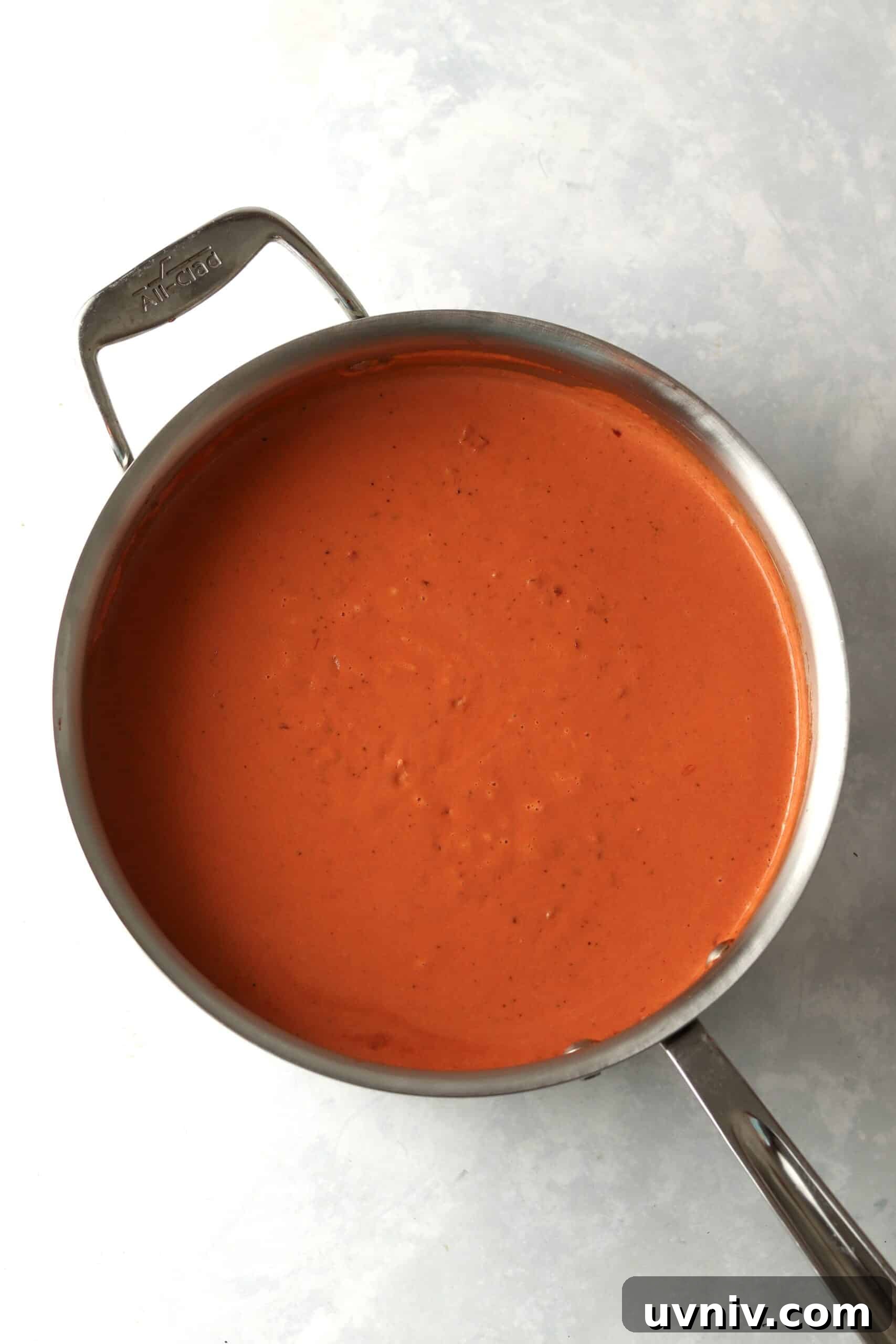 Spicy Rigatoni alla Carbonara — Copycat Restaurant Recipe 6 spicy vodka sauce in pot.