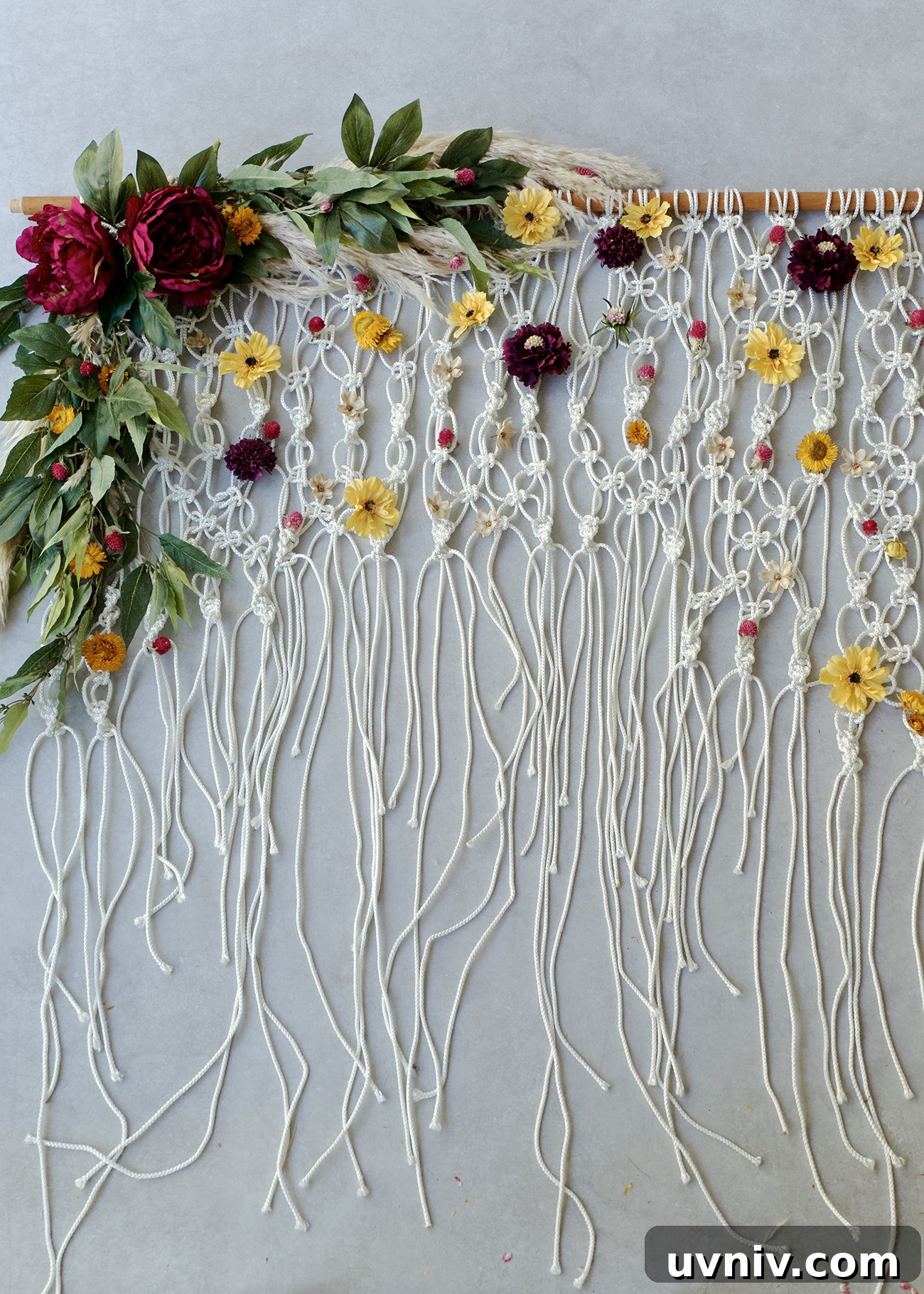 9 Stylish Macramé Projects to Update Your Home Décor 3 DIY Silk Floral Macramé Backdrop from Green Wedding Shoes | 8 Modern DIY Macrame Projects