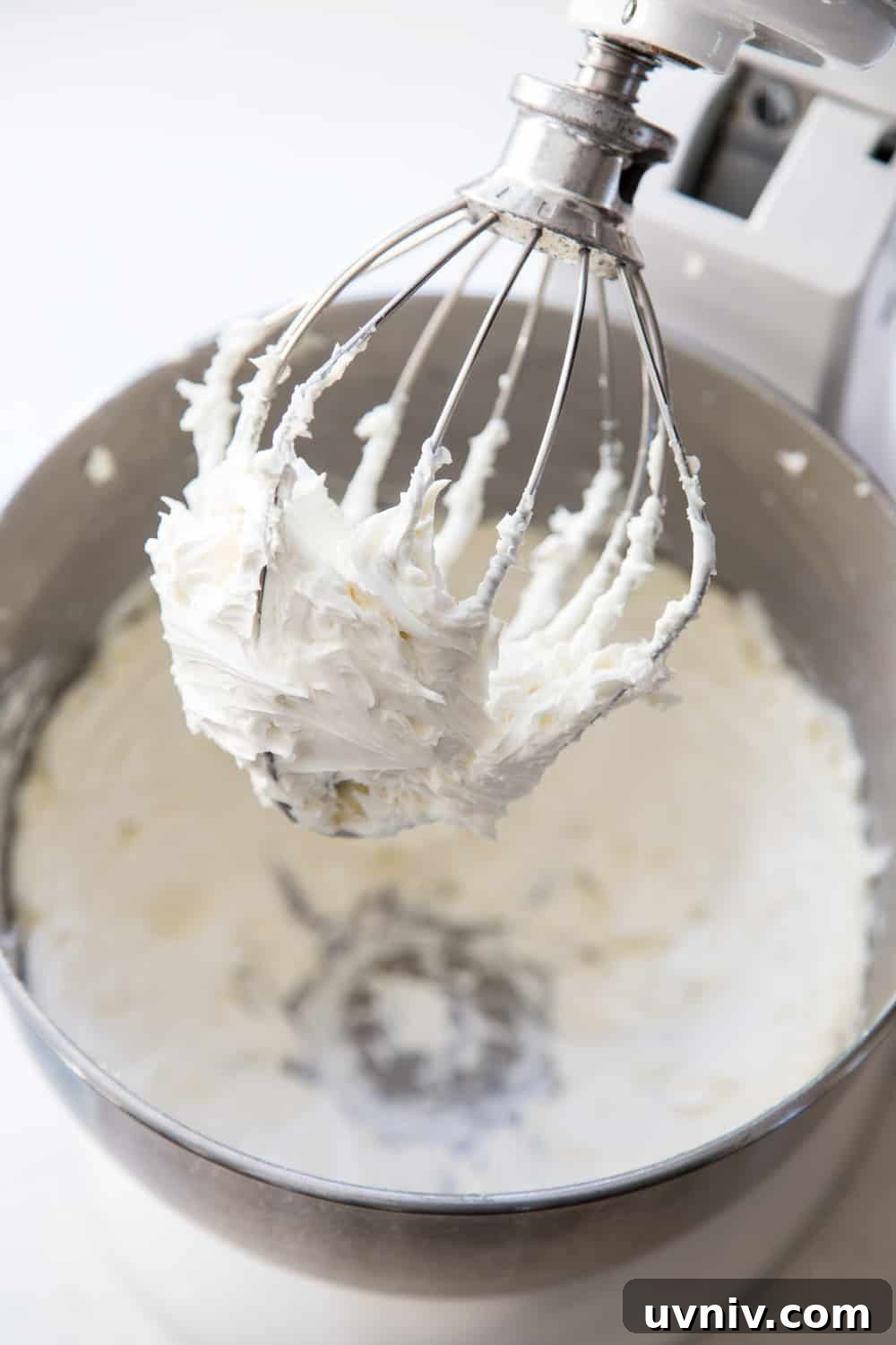Vanilla buttercream frosting in a stand mixer bowl