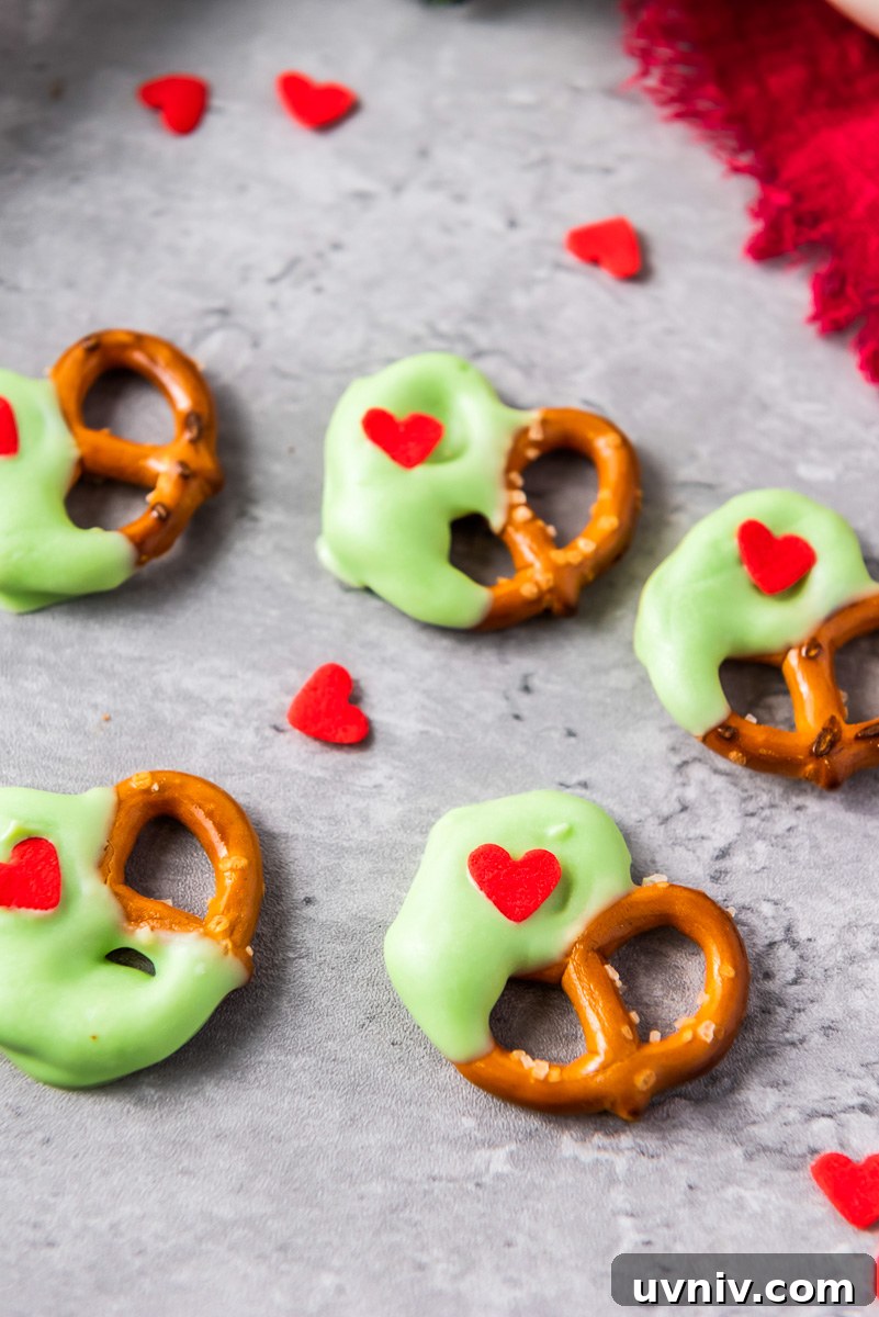 Green chocolate covered pretzels with red heart sprinkles