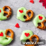 Grinch Christmas pretzels treats on the counter.