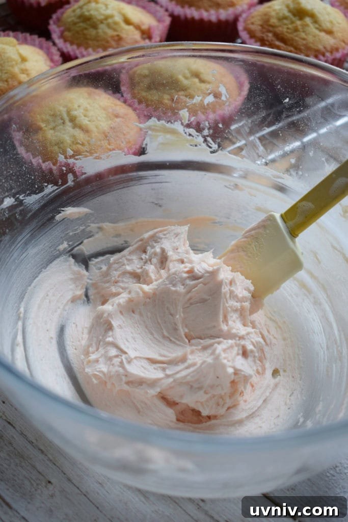 pink frosting in a bowl