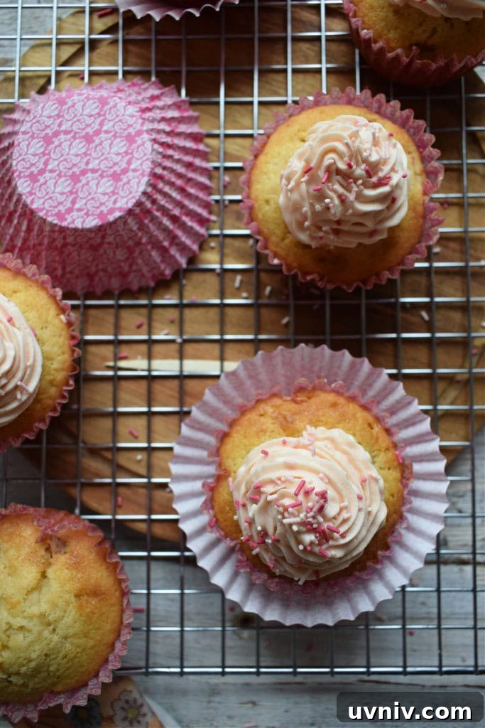 fresh strawberry cupcakes on a cooling rack