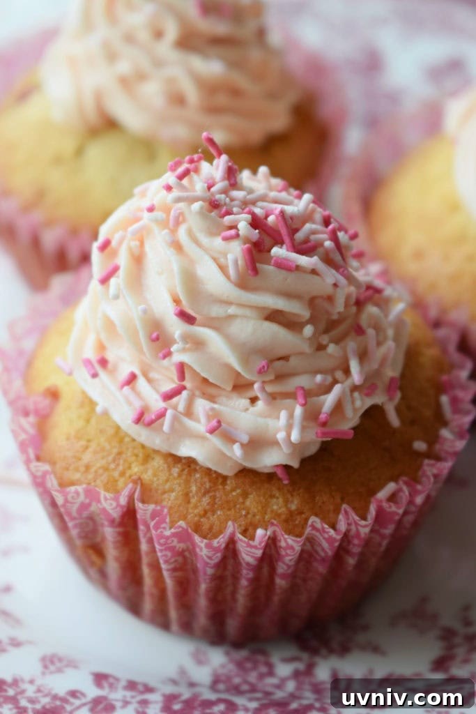 close up of strawberry cupcakes with buttercream frosting