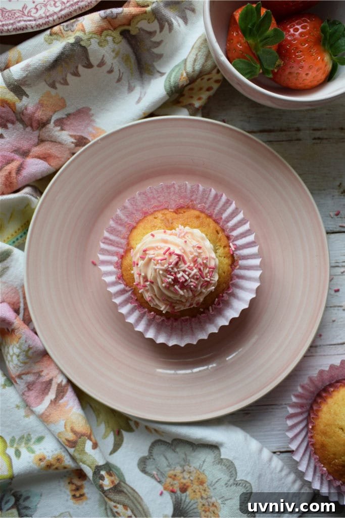 Cupcake on a plate with strawberries