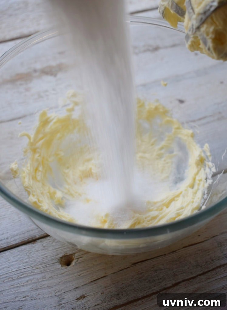 pouring sugar into a mixing bowl