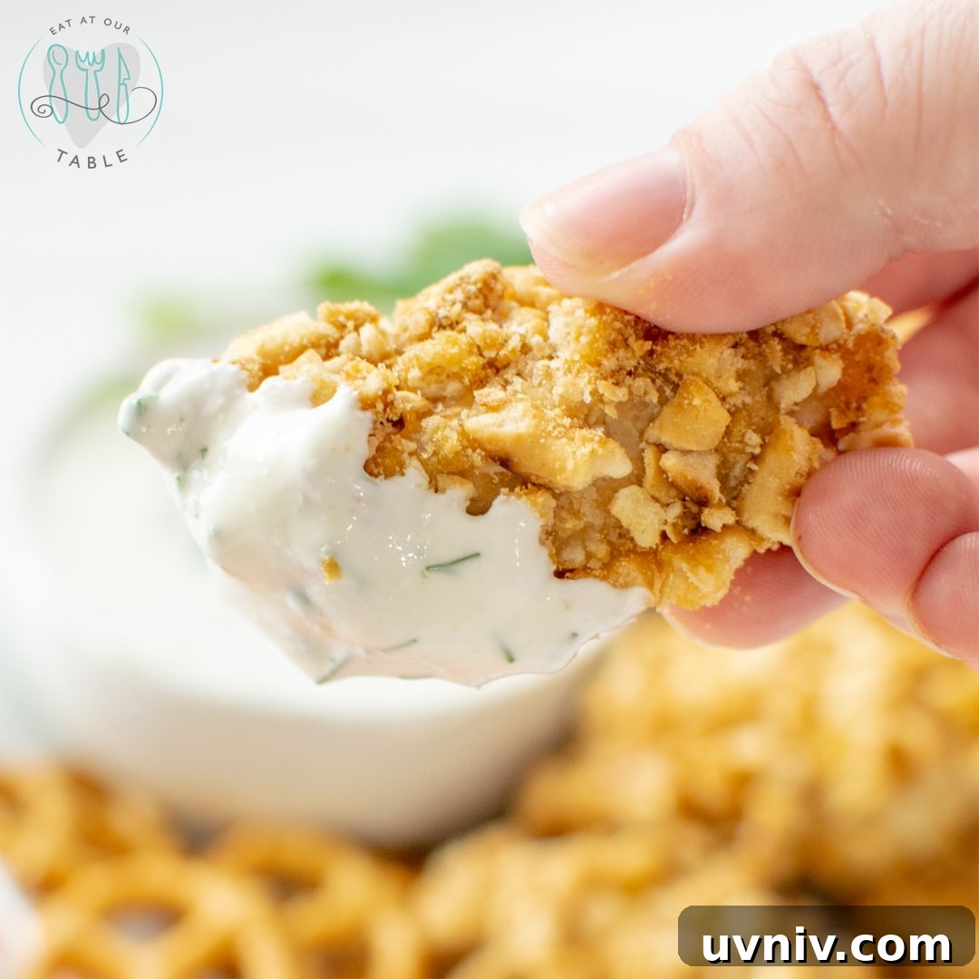 Pretzel crusted chicken nuggets with Greek yogurt herb dipping sauce