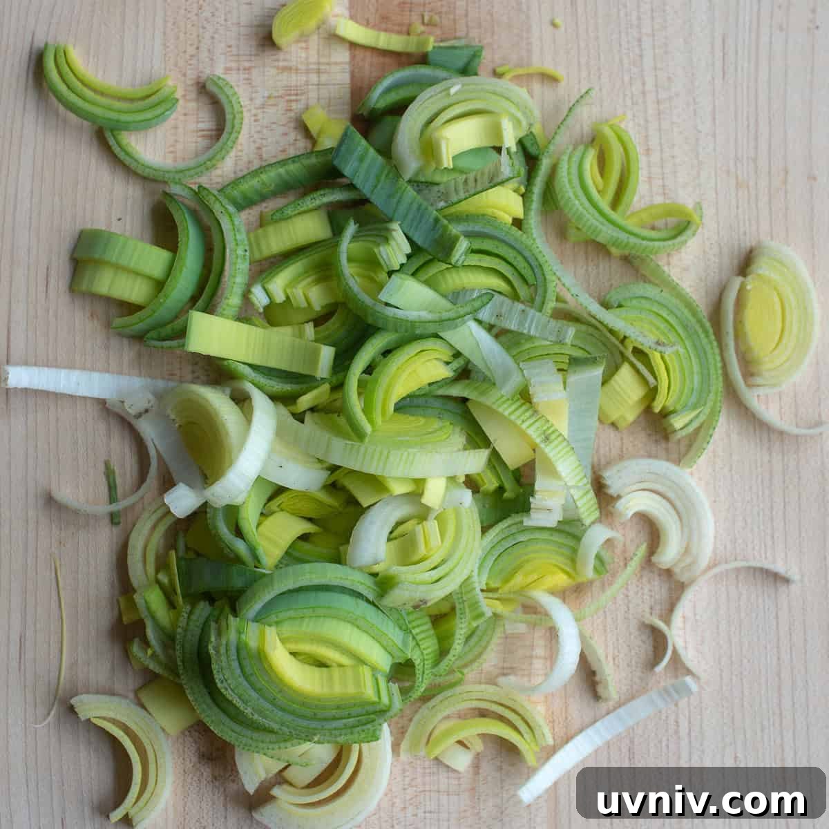 Sliced leeks on a cutting board.
